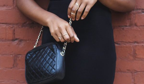 woman holding expensive handbag